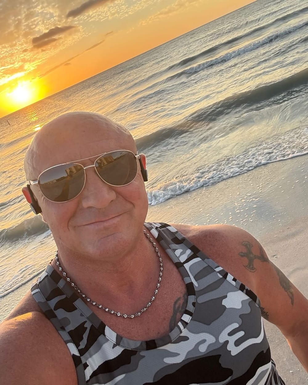 Rudy, the owner of Mr. Klean Up, on the beach in Pinellas County, Florida